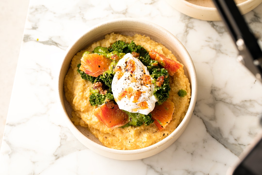 services-01 Parmesan Polenta with poached egg, kale and blood orange by Bakd&Raw, Karolin Silja Baitinger