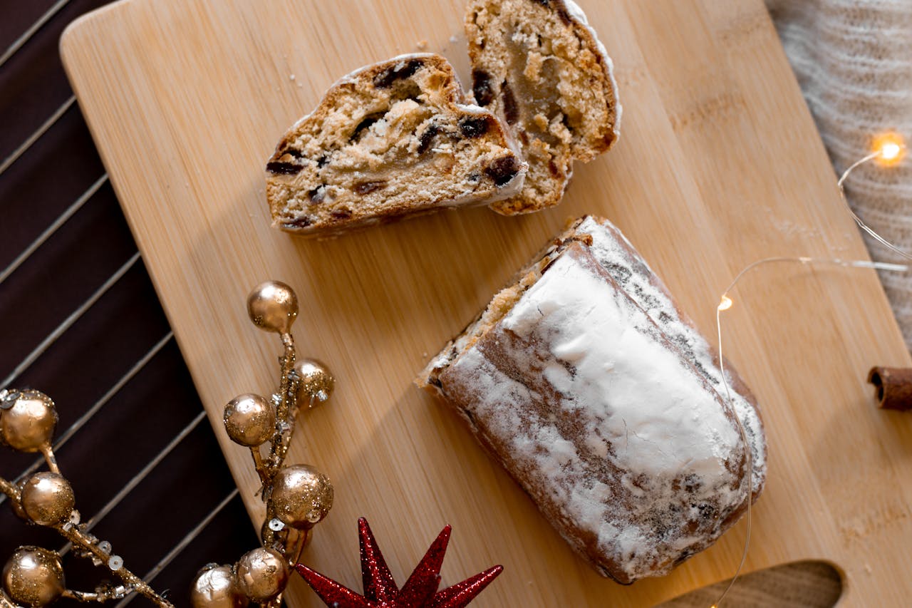 home-hero-bg A delicious sliced stollen bread with dried fruits, perfect for festive occasions.